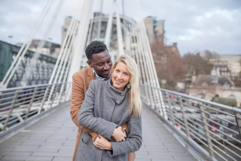 A man embracing a woman